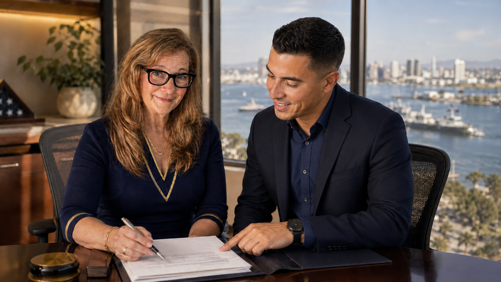 Advisor and client reviewing benefits documents in a professional office overlooking the harbor.
